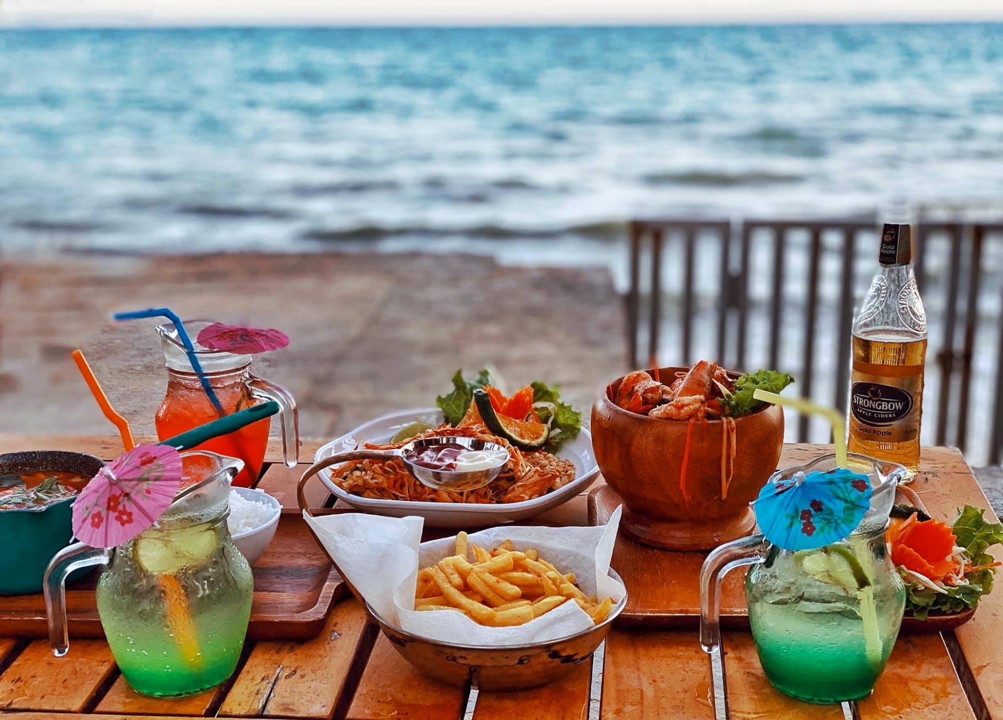 In the Chameleon Beach Bar section — beachfront tables and sea view