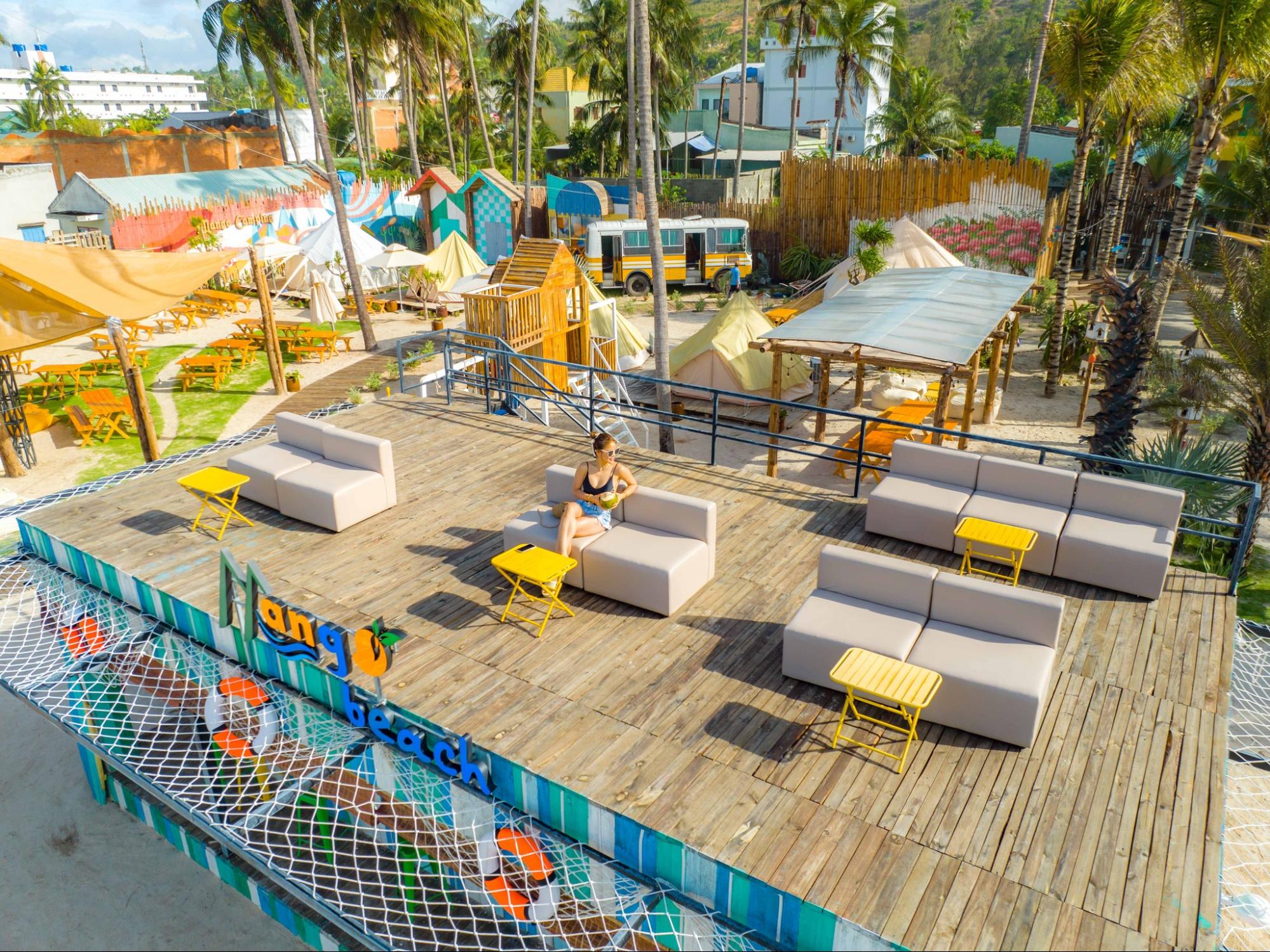  In the Mango Beach section — boho-style beach lounge in white and beige tones 